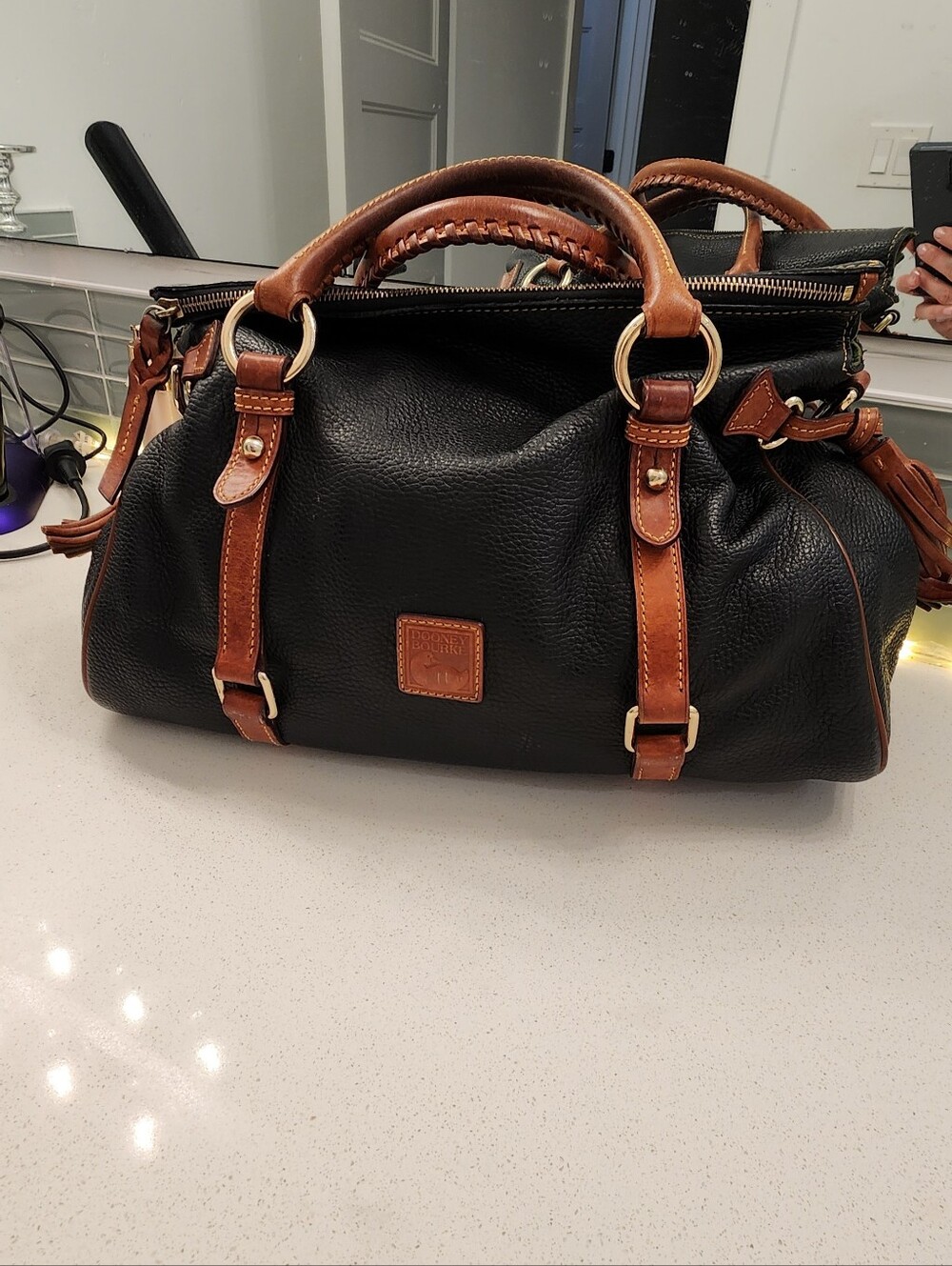 Dooney & Bourke Black Leather Satchel with Brown Trim